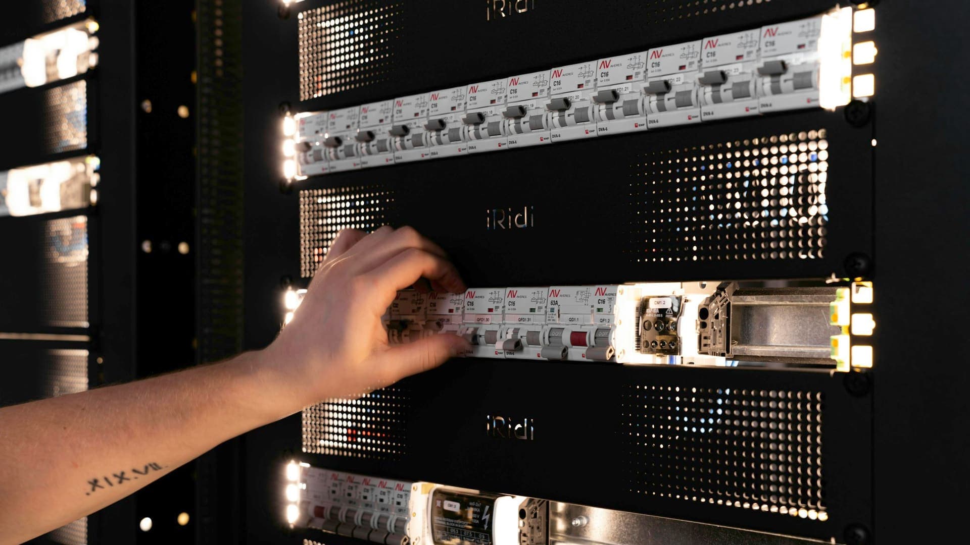 Hand adjusting equipment in a lit server rack