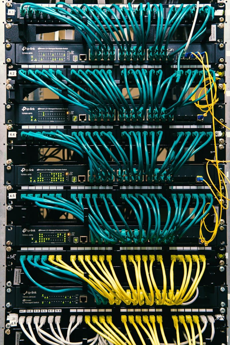 Network switches in a rack with neatly routed patch cables